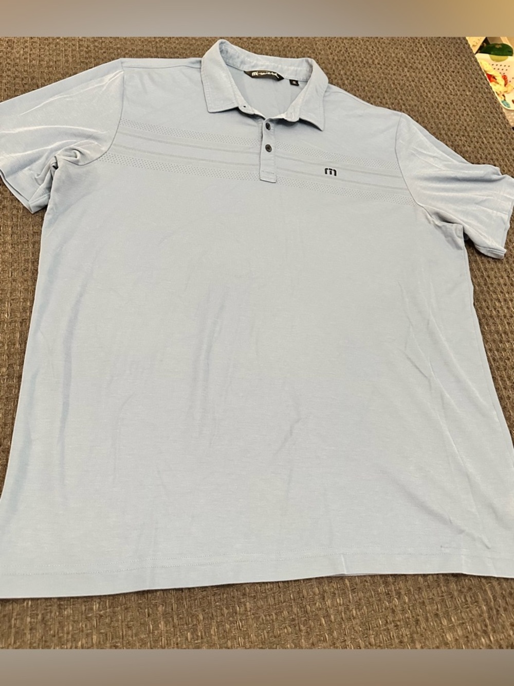 Travis Mathew blue polo shirt